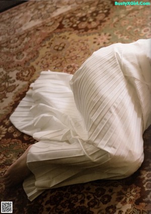 A collage of photos of a woman laying on a bed.