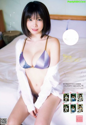 A woman in a bikini holding a plate of food.