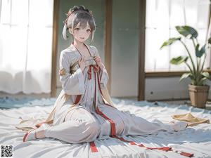 A woman in a white kimono sitting on the ground.