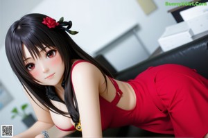 A girl sitting on a wooden floor in front of a window.