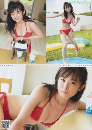 A woman in a red bikini standing in a pool of water.